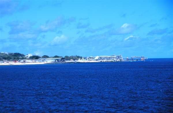 The phosphate ore loading piers on Nauru, which has no natural or protected harbor.  Photo courtesy of NOAA/ Lieutenant Mark Boland