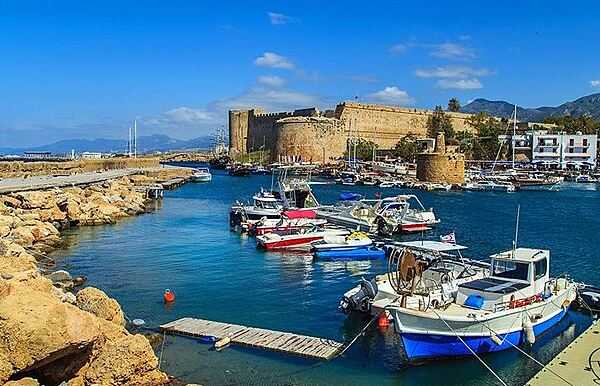 Kyrenia ("Girne" in Turkish) is a city on the northern coast of Cyprus. A market center and seaside resort, its horseshoe-shaped harbor is flanked by a 12th-century castle fortress.
