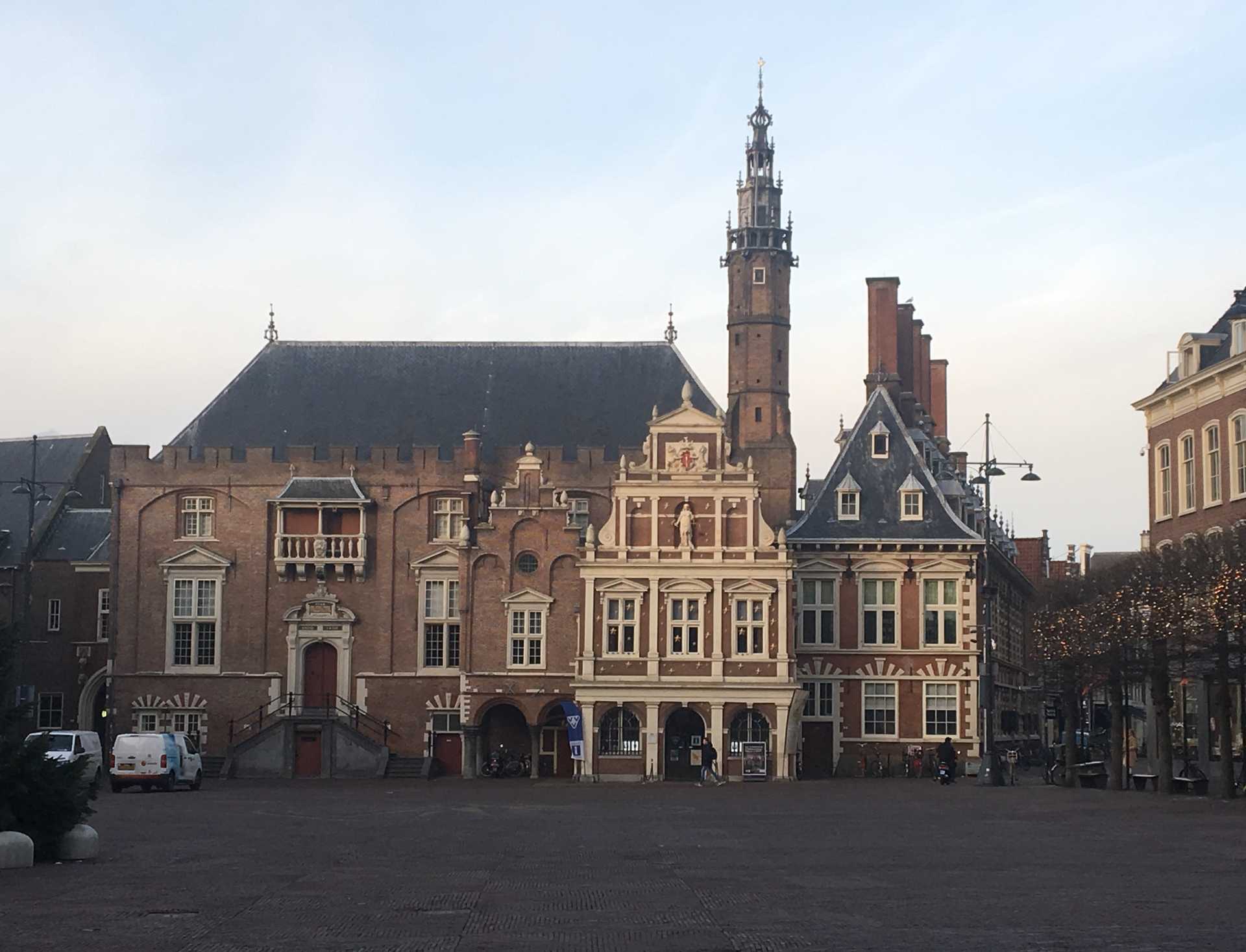 A view of Haarlem City Hall. Haarlem, located about 15 km (9 mi) west of Amsterdam in the Netherlands, dates to the 1200s and was home to several famous Dutch artists.