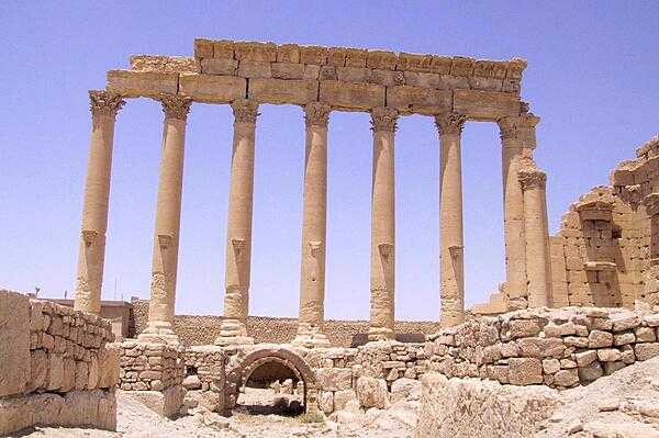 Temple ruins at Palmyra in central Syria. The city changed hands between a number of empires before falling under the Roman Empire in the first century A.D. Palmyra accumulated great wealth as a nexus for trade caravans, which then allowed for the construction of monumental building projects, many of which survive in a ruined state.